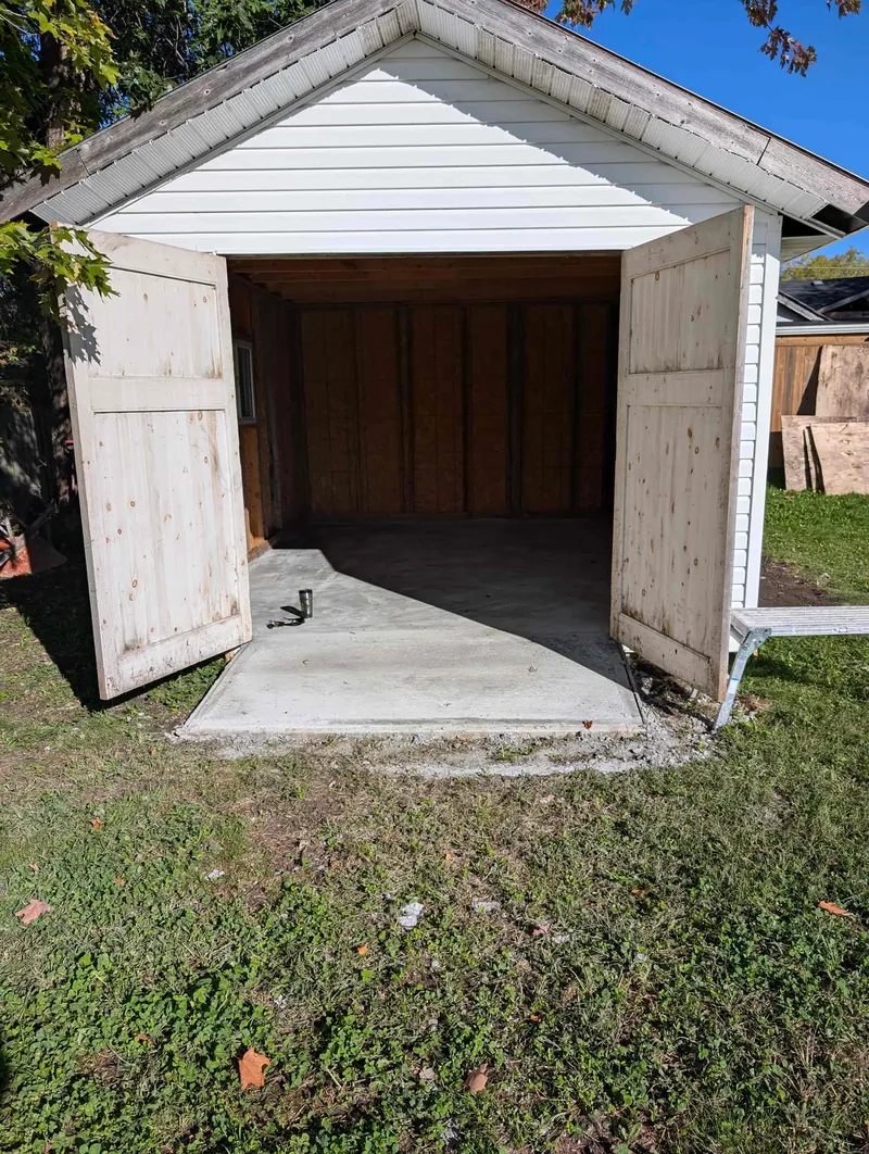 Concrete floor bed poured inside the shed